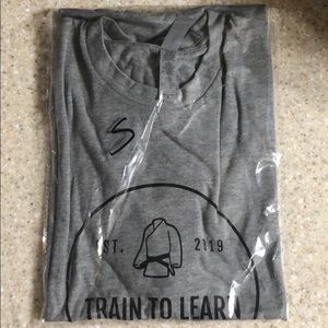 Train to learn apparel™️ T-shirt